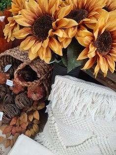 sunflowers and other autumn decorations are on display