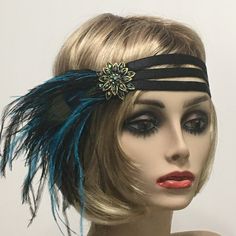 Flapper 1920s headband, Gatsby headband, Black 1920s headpiece, Feather Headpiece, 1920s hair accessory, Vintage inspired This stunning 1920's Vintage Inspired Gatsby headband is the perfect accompaniment for any 1920s styled event. I've designed and created this one-of-a-kind headband so feminine and romantic. Made with three bands of a Satin Black elastic ribbon. This makes the headband self-adjusting.  Accompanied with Black and Teal Ostrich feathers. Featuring a Peacock Eye. I embellished this headpiece with a Vintage inspired Rhinestone Borealis Brooch.   I have designed and created each piece from my smoke-free studio. All pieces are securely wrapped and boxed to prevent damage/breakage. Ready to ship.  Feel free to convo me if you have any questions. Thank you very much for visiting Flapper Evening Headpiece With Feathers, Black Flapper Headpiece For Costume Party, Black Gatsby Style Fascinator, Black Flapper Headpieces For Vintage Events, Black Flapper Headpieces For Party, Flapper Style Feather Headpiece For Vintage Events, Flapper Style Feathered Headpieces For Vintage Events, Gatsby Style Feather Headpieces For Vintage Events, Vintage Black Headpieces For Costume Party