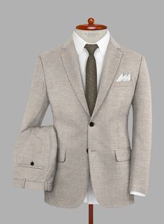 Emulate every experience with graceful precision with the Loro Piana Elettra Wool Silk Linen Suit, a testament to understated prestige. This versatile ensemble features a blend of wool, silk, and linen in a classic beige hue with a solid pattern. The luxurious fabric composition ensures a breathable feel with a subtle sheen, making it ideal for warmer seasons and formal affairs alike. Whether commanding upscale gatherings or attending a summer soirée, this suit exudes timeless style and impeccable taste.   A marriage of elegance and comfort, Loro Piana fabrics are made using the highest quality raw materials in the world, in their purest form or blended together. A sophisticated response to the dictates of contemporary elegance, these fabrics lend themselves to a wide range of styles to me Cream Linen Suit For Semi-formal Occasions, Elegant Beige Suits With Welt Pockets, Elegant Beige Wool Suit, Elegant Beige Business Suit, Elegant Tailored Beige Suits, Classic Cream Suits For Business Casual, Classic Cream Suit For Business Casual, Timeless Beige Suits With Pressed Crease, Timeless Linen Suit