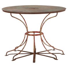 an iron table with a circular top