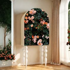 an arched window with pink flowers on it in front of a white wall and wooden floor