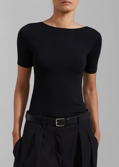 Color: Black Lightweight fluid fabric with stretch Relaxed fit Boat neck Low rounded back Short sleeves Slip on style Unlined 96% Rayon 4% Elastane Machine Wash Cold By The Frankie Shop. Imported The Frankie Shop, Frankie Shop, Back Shirt, Boat Neck, Black Shirt, Short Sleeves, Slip On, Relaxed Fit, Fabric