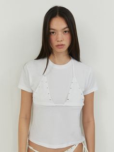 This is a casual and feminine top by MORE THAN PARADISE that is made out of high quality and sturdy material. With distinctive mood of the design and comfortable wear, you can style it for your casual daily outfit.- Halter neck bra top layered- Embroidery and silver hardware on the chest- Trendy, casual and feminine mood Trendy Cotton Tops With Built-in Bra, Triangle Top With Built-in Bra For Day Out, Chic Tops With Built-in Bra For Layering, Chic Stretch Bra-friendly Top, Chic Stretch Tops Bra Friendly, Summer Fitted Top Bra Friendly, Fitted Bra Friendly Top For Summer, Trendy Cropped Tops, Bra Friendly, Spring Fitted Top, Bra Friendly