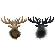 two deer head ornaments hanging from strings on a white background, one is brown and the other is black