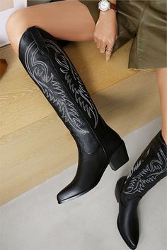 Girl, get ready to step up your shoe game with these Black Cowboy Boots! These babies are the perfect combination of fierce and fabulous, and will have you strutting with confidence wherever you go. Crafted from high-quality materials, these knee high boots are built to last and can handle any adventure you throw their way. The knee high length provides extra coverage, making them the perfect choice for any occasion, whether you're hitting up a country concert or just running errands in style. A Western Style Black Knee-high Boots With Reinforced Heel, Western Black Knee-high Boots With Reinforced Heel, Black Western Knee-high Boots With Reinforced Heel, Black Mid-calf Platform Boots For Winter, Wide Calf Knee-high Boots With Reinforced Heel, Trendy Black Knee-high Boots With Round Toe, Western Style Black Knee-high Boots Medium Width, Western Style Black Platform Boots For Fall, Black Western Style Knee-high Boots Medium Width