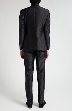 The brand's slim Sicilia fit shows off the silk-shantung construction to its fullest richness of texture and sheen on this Italian-tailored two-piece suit. Jacket has peaked lapels; four-button cuffs; chest welt pocket; front flap pockets; two interior pockets; back vent Pants have zip fly with hook-and-bar closure; front slant pockets; coin welt pocket; back button-welt pockets Jacket is lined; trousers are lined to the knee 100% silk Dry clean Made in Italy Men's Designer Clothing Classic Satin Suits For Semi-formal Occasions, Elegant Satin Suits With Notch Lapel, Classic Tailored Satin Suits, Tailored Satin Elegant Suit, Elegant Satin Suits With Suit Collar, Classic Satin Business Suit, Classic Fitted Satin Suit, Tailored Satin Suits For Formal Occasions, Classic Fitted Evening Sets