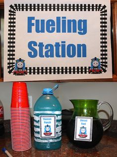 there is a sign that says fueling station on the wall next to some cups