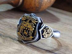 "Your custom solid sterling Silver ring will be made on your order, customize this Coat of Arms and your logo on this collection! A beautiful symbol that will fit your hands and style. perfect gift for anniversary, special dates and any date you can imagine can be Personalized. Different colors are silver, gold, rose gold. White gold and 24K gold options will never tarnish and last decades. Please contact me if you are interested in my jewelry. >ABOUT ME: I have 35 years of experience in making custom handmade silver and gold jewelry, including custom engraved Signet rings My childhood kind of allowed me to live among precious metals and gems pretty much I opened my workshop back in 1986 Never got bored of making Personalized gifts, birth flower rings, engagement rings with real diamonds F Formal Black Engraved Ring With Engraving Option, Black Engraved Ring For Formal Occasions, Black Sterling Silver Signet Ring With Engraving Option, Symbolic Black Engraved Ring For Anniversary, Luxury Engraved Logo Jewelry For Gift, Classic Black Engraved Ring, Vintage Engraved Customizable Ring For Anniversary, Vintage Customizable Engraved Ring For Anniversary, Customizable Vintage Engraved Ring For Anniversary