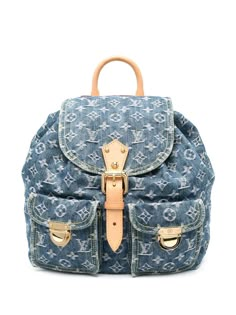 2003 pre-owned monogram denim backpack from Louis Vuitton Pre-Owned featuring indigo blue, cotton, calf leather, jacquard, monogram pattern, foldover top, buckle-strap fastening, drawstring fastening, single rolled top handle, two adjustable shoulder straps, two front flap pockets, internal logo patch, internal jetted pocket, full lining, gold-tone hardware, bucket body and circa 2003. Conscious: Purchasing this item continues its narrative and reduces the environmental impact of using new resou Louis Vuitton Vintage Bag, Louie Vuitton, Cute Mini Backpacks, Louis Vuitton Backpack, Denim Backpack, Pre Owned Louis Vuitton, Mini Backpacks, Closet Organizer, Monogram Pattern