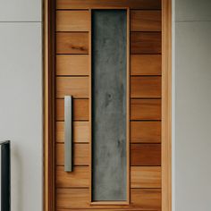 the door is made of wood and has a metal handle on it's side