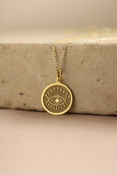 Gold Evil Eye Pendant -  Evil Eye Gold Necklace ● Material of pendant: Solid Gold 14k ( REAL GOLD ) ● Metal Stamp: 14k ( REAL GOLD ) ● The pendant is available in 5 sizes: - 12,7 mm / 0.5 inches (Diameter) - 14,0 mm / 0,55 inches ( Diameter ) In the photos - 15,3 mm / 0.6 inches ( Diameter ) - 16,5 mm / 0,65 inches ( Diameter ) - 19,1 mm / 0,75 inches ( Diameter ) ( In the photos the size is 14mm / 0.55 inches Diameter ) ( Jump Ring inner diameter: 4 mm ) ● Material of chain: Solid gold 14k ( RE Symbolic Brass Jewelry With Coin Pendant, Gold Medallion Necklace With Charms, Gold Charm Necklace With Medallion, Round Charms Amulet Necklace, Brass Charms Necklace With Round Shape, Symbolic Gold Plated Coin Jewelry, Brass Round Charm Necklaces, Gold Plated Charms Necklace With Round Shape, Gold Plated Round Amulet Charm Necklace