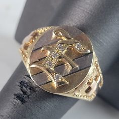 A Mens Vintage Estate 14k Multi Tone Gold Religious Cross Ring With The Letter "E" On The Face. The Ring Size Is A 10.0, And Weighs 8.7g. The Width Of The Band Is About 5/8", And Has About .05cts Of Diamonds. This Would Make A Nice Gift For That Someone Special. Any Other Questions Please Do Not Hesitate To Ask. Be Sure To Check Out Some Of My Other Great Items Up For Sale. Thank You. Heirloom Diamond Initial Ring, Hallmarked, White Gold Diamond Signet Ring Stamped 14k, Yellow Gold Diamond Initial Ring Hallmarked, Diamond Yellow Gold Hallmarked Signet Ring, Formal Diamond Initial Ring Stamped 14k, Yellow Gold Diamond Signet Ring Hallmarked, Hallmarked Oval Diamond Initial Ring, Collectible 14k Gold Hallmarked Diamond Ring, Formal 14k Stamped Diamond Initial Ring