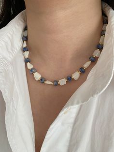 Wrap yourself in the tranquil energy of our handmade Blue Dot Jade Necklace, a unique masterpiece adorned with natural shell beads and gold-plated round beads. Each bead, measuring 8*4mm, is carefully selected to showcase the beauty of Blue Dot Jade, capturing a nature-inspired, chic, and dynamic style that's perfect for all occasions. 💙 Benefits and Birthstone Information: Blue Dot Jade is revered for its calming properties, believed to soothe the mind and promote inner peace. As a birthstone Beaded Jewelry With Shells, Everyday White Beaded Necklaces With Natural Stones, Natural Stone Shell Necklace With Round Beads As Gift, Holiday Accessories, Beads Ideas, Jade Gemstone, Natural Stones Necklace, Size Difference, Natural Stone Jewelry