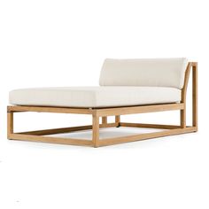 a wooden chaise lounge chair with white cushions