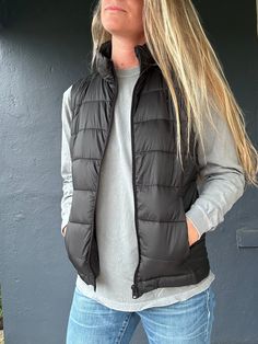 Stay toasty and on trend with the Beacon 2 Vest! This ultra-cozy puff vest has a high-neck design and a storage pouch for all your essentials. Keep warm and snug whether you’re out and about or just lounging around. Feeling fly has never been so easy! Trendy Winter Vest For Everyday Wear, Trendy Outdoor Winter Vest, Casual Solid Vest For Cold Weather, Trendy Sleeveless Vest For Outdoor, Casual Sleeveless Everyday Outerwear, Casual Puffer Vest For Outdoor Activities, Casual Sleeveless Puffer Jacket For Cold Weather, Casual Nylon Vest For Cold Weather, Sleeveless Functional Puffer Jacket For Cold Weather