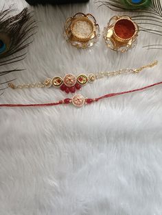 This Raksha Bandhan, show immense love to your brother with these handcrafted Rakhis. These rakhis are gold-plated and embellished with Meenakari Kundan, beads, pearls, and stones. Material: Skin Friendly Metal Alloy Bhabhi Rakhi Design, Rakhi Designs Handmade, Gold Rakhi, Ig Questions, Bhabhi Rakhi, Handmade Rakhi Designs, Raksha Bandhan Gifts, Rakhi Making, Rakhi Gift