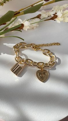 Lock and Heart charm bringing on mind the promises of Eternal Love between each others 𝐌𝐀𝐓𝐄𝐑𝐈𝐀𝐋: 18k Gold plated bracelet 𝐂𝐀𝐑𝐄 𝐓𝐈𝐏𝐒: Avoid contact with moisture (water, perfume and other chemicals) Mostly take off jewelry when exercising, showering, sleeping When not in use store your pieces in the jewelry bag or box. Water Perfume, Jewelry Bag, Gold Plated Bracelets, Wide Belt, Eternal Love, Jewelry Bags, Care Tips, Heart Charm, Chain Bracelet