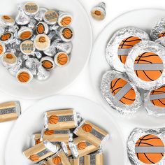 two plates with basketballs and herspoo wrappers next to each other on them