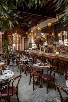 an empty restaurant with many tables and chairs