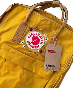 Casual Standard Backpack With Embroidered Logo, Embroidered Logo Travel Bags For Back To School, Back To School Travel Bags With Embroidered Logo, Travel Bags With Embroidered Logo For Back To School, Casual Embroidered Backpack, Casual Backpack With Embroidered Logo For Daily Use, Embroidered Patch Backpack For Everyday Use, Ochre Yellow, Floral Backpack