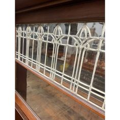 an old window with glass and wood trim