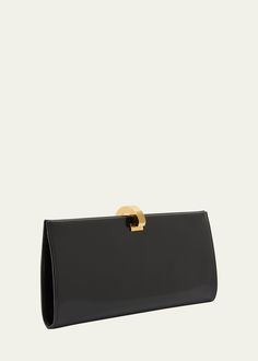 "Find SAINT LAURENT Ysl Embossed Ring Closure Evening Clutch Bag In Patent Leather on Editorialist. Saint Laurent clutch bag in sleek calf leather Embossed YSL logo at front Open top with golden ring flip-lock closure Interior, card slot Approx. 4.3\"H x 10.2\"W x 1.2\"D Professional cleaning recommended Made in Italy" Ysl Evening Bag, Saint Laurent Clutch, Black Metal Rings, Ysl Clutch, Luxury Clutch, Envelope Clutch Bag, Ysl Logo, Leather Frames, Golden Ring