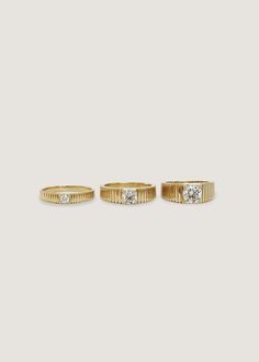 Inspired by Jennie's mother's vintage pleated ring, the Solis collection represents energy and strength. Our Solis Ring features a round brilliant diamond is prong set in a 14k solid gold ribbed band. 14k solid gold—always Non-hollow Average weight: 6.9g Band width: 6.8mm (front), 3.6mm (back) Diamond 4 C's: 1cw, Round Brilliant, VS2, G/H, Excellent Cut Custom sizing is available. Custom sized pieces are final sale. This piece cannot be resized. Our natural ring is made to order. Please allow at Ribbed Ring, Rib Ring, Vintage Inspired Engagement Rings, Fall Rings, Solid Gold Band, Vs2 Diamond, Nature Ring, Average Weight, Twist Ring