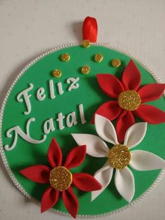 a cake decorated with red and white poinsettis on top of a green plate