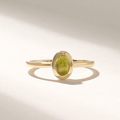 Introducing the exquisite Solid Gold Green Peridot Ring, a true masterpiece in the realm of fine jewelry. Handcrafted with utmost precision and attention to detail, this ring combines the timeless elegance of solid gold with the radiant allure of a bezel-set solitaire gemstone. Features * Gold KT: 10K, 14K, 18K * Custom Gold Color: Rose Gold, Yellow Gold, White Gold * Top of Band: 8.00x6.60MM * Width of Band: 1.50MM * Thickness of Band: 1.30MM * Main Gemstone: Natural Peridot * Total Ctw: 0.50 Ctw * Ready to Ship in 5-7 Business Days ✓ We care about the environment,the jewelry we cast is made with recycled gold. We source exclusively post-consumer material that is refined back to their pure elements to ensure that the gold is in the same quality. Our designs are made from 14k/18k/10k real Heirloom Gold Tourmaline Ring, Yellow Gold Tourmaline Ring With Polished Finish, Yellow Gold Tourmaline Ring, Yellow Gold Rings With Polished Finish And Round Stone, Gold Tourmaline Ring For May Birthstone, Oval Emerald Ring In Gold-toned Sterling Silver, Elegant Peridot Birthstone Ring In Yellow Gold, Polished Tourmaline Ring As Gift, Formal Tourmaline Rings With Bezel Setting