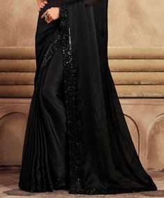 COLOR : Black FABRIC : Saree - Chiffon, Blouse - Chiffon & Net WORK : Resham Embroidery, Stones, Sequins, Lace BorderOCCASION : Wedding, Engagement, Party Wear, Festival, Sangeet NOTE : The outfit includes blouse and saree only. Petticoat is not included. READY-TO-WEAR : No STITCHING : Available as semi-stitched fabric, can be stitched using standard size option (+$30). Note: There might be a slight color variation due to lighting and flash used during photoshoot. The bright shade seen is the best closer view of fabric's color. Elegant Embroidered Embellished Art Silk Fabric, Formal Saree With Embroidered Border, Evening Georgette Dupatta With Intricate Embroidery, Fitted Georgette Embroidered Fabric For Formal Occasions, Fitted Georgette Embroidered Fabric For Formal Wear, Fitted Embroidered Georgette Fabric For Formal Wear, Evening Traditional Wear With Intricate Embroidery On Georgette, Evening Traditional Wear With Intricate Embroidery, Embellished Georgette Dupatta For Formal Occasions