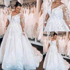 a woman in a white wedding dress standing next to dresses hanging on hangers and smiling