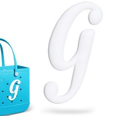 a blue bag with the letter g on it next to a white object that looks like an ear