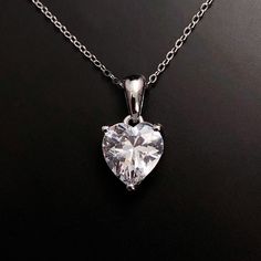 Solid Sterling Silver Clear Topaz necklace. Diamond is the April birthstone, get the look for April with this beautiful birthstone heart pendant in clear Topaz.  Matching earrings available here: https://www.etsy.com/listing/1338805708/  Available to order in gold, white gold, rose gold or platinum, please contact me for prices.  💎Pendant thickness: 6mm 💎Pendant width: 9mm 💎Pendant overall Length: 17mm 💎Chain length: 18 inch or other length if required.  ✨ For free giveaways, special offers Classic Heart-shaped Birthstone Necklace, Cubic Zirconia Heart Cut Birthstone Jewelry, Classic Heart Cut Birthstone Necklace, Crystal Jewelry With Heart Charm For Gifts, Mother's Day Heart Cut Crystal Heart Necklace, Classic Heart Shaped Birthstone Jewelry, Classic Heart-shaped Birthstone Jewelry, Anniversary Crystal Jewelry With Heart Charm, Crystal Heart Pendant Necklace Gift