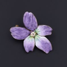 During Victorian and Edwardian times the gift of violets suggested that the giver's thoughts were occupied with love.   A perfect love token, this 14k gold and purple enamel brooch/pendant features a glistening diamond accent at its center. The piece measures 1.4 inches from top to bottom by 1 inch wide, and it is in excellent condition.  We have many other fantastic offerings of period fine jewelry posted on our Etsy store, so please consider browsing our other items. We send all items in indiv Small Edwardian Purple Brooch, Yellow Gold Enamel Brooches For Gifts, Hallmarked Enamel Brooches As Gifts, Hallmarked Enamel Brooches For Gifts, Gift Enamel Brooches Hallmarked, Antique Purple Brooches As Gift, Lavender Brooch Jewelry As A Gift, Purple Brooch Jewelry Gift, Gold And Purple