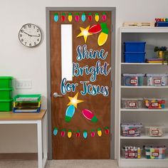 a door with the words shine bright for jesus painted on it in front of a bookcase