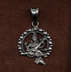 Indian Hindu Idols Blessing Goddess Saraswati or Sharda maa vintage antique style stunning divine pendant, best gifting unisex jewelry from India. Metal-925 sterling silver. Item type-Pendant Weight-4.630 grams. Height-3.8 centimeter. Width-2.2 centimeters. Stamped-925. Finish-Oxidized. Make excellent gifting and collectible pieces(gift for birthday, wedding, anniversary, mother's day, fathers day, Christmas day,) Navratri Brass Jewelry Gift, Symbolic Pendant Jewelry For Festivals, Traditional Jewelry With Antique Finish Round Pendant, Traditional Round Pendant Jewelry With Antique Finish, Traditional Antique Finish Round Pendant Jewelry, Oxidized Finish Necklaces For Navratri Gift, Oxidized Finish Necklaces As Navratri Gifts, Symbolic Jewelry For Rituals And Festivals, Symbolic Jewelry For Festivals