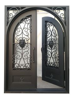 an ornate iron door with two sidelights