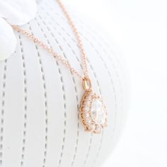 Tiara halo diamond pear moissanite pendant rose gold drop necklace la more design jewelry Wedding Pear-shaped Necklace With Halo Setting, Rose Gold Teardrop Halo Jewelry, Pear-shaped Necklace With Halo Setting For Wedding, Diamond Drop Pendant, Rose Gold Tiara, Pear Halo, Gold Tiara, Pear Ring, Moissanite Necklace