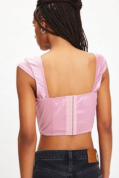 Super sweet Out From Under top in a tailored, corset-inspired style. Designed in a sleek satin with a touch of sheen featuring a square neckline, mini cap sleeves and boning down the corset. Finished with a v-shape hem for a romantic finish. Only at Urban Outfitters. Features Out From Under Out Of Time satin corset top Satin bustier bra top Soft-touch satin Square neckline and mini cap sleeves Corset boning down the bodice V-shape hem Slim, tailored fit Cropped length Hook-and-eye closures UO ex Out From Under Top, Satin Corset Top, Satin Bustier, Corset Boning, Top Satin, Satin Corset, Out Of Time, Pink Fits, Women Men Shoes