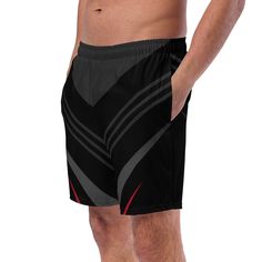 These men's swim trunks are perfect for a hot summer day. They are quick-drying, breathable, and have multiple pockets for your belongings. The silky, anti-chafe inner liner ensures maximum comfort. The trunks feature a stylish striped black, red, and gray geometric line pattern with a boho aesthetic and art deco design. These swim trunks are a great choice for anyone looking for a comfortable and fashionable bathing suit for summer activities. Don't wait, get yours now! • Fabric composition: (may vary by 5%) 91% recycled polyester, 9% spandex• Liner composition: 92% polyester, 8% spandex• Fabric weight (may vary by 5%): 5.13 oz/yd² (174 g/m²) • Four-way stretch water-repellent microfiber fabric• Anti-chafe mesh inner liner• Elastic waistband with drawcord• Mesh pockets• Small inside pocke Black Bottoms With Built-in Shorts For Water Sports, Black Short Swim Trunks For Water Sports, Black Short Swim Trunks For Swimwear, Moisture-wicking Swimwear For Sports, Black Swim Trunks With Built-in Shorts For Beachwear, Black Nylon Swim Trunks For Water Sports, Black Shorts With Built-in Shorts For Water Sports, Black Breathable Swimwear For Beach, Black Sporty Shorts For Water Sports