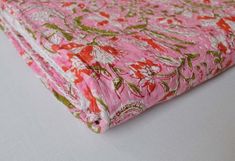 a pink and green floral print fabric