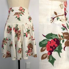 1940s Adorable vintage Pique floral cotton tiered skirt. Side buttons. Cute summer Forties era play wear. No labels, likely home seamstress. Excellent condition with some slight yellowing. MEASURES : waist= 26 hips= 36 length= 23 ALL SALES FINAL Vintage Tiered Skirt With Floral Print, Vintage Cotton Ruffle Skirt, Vintage Ruffled Cotton Skirt, Vintage Cotton Skirt With Ruffles, Vintage Cotton Tiered Skirt, Vintage Tiered Skirt For Garden Party, Vintage White Floral Print Skirt, Retro Floral Print Cotton Skirt, Vintage Cotton Floral Print Skirt