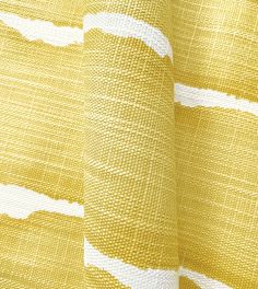 a yellow and white curtain with lines on it