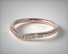 a rose gold wedding band with channeled diamonds