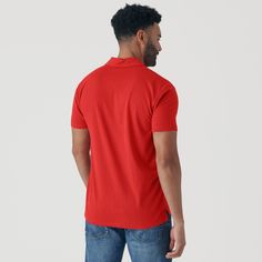 This item is FINAL SALE and is not eligible for exchanges or refunds. Features: Premium fitted short sleeve polo Three-button placket 60% combed ringspun cotton/40% polyester jersey Fabric will shrink minimally (5%) on a low heat setting in the dryer Classic side seam for the best look & fit Soft tag – tag is screen-printed on the polo for maximum comfort Fit: This is a contemporary/athletic cut. First model is 6'0" / 165 lbs and wearing size M Second Model is 6'1" / 250 lbs and wearing size XL Basic Plain Cotton Polo Shirt, Fitted T-shirt With Button Closure, Classic Plain Cotton Polo Shirt, Classic Cotton Plain Polo Shirt, Classic Red Tops With Collared Neckline, Basic Plain Collared Polo Shirt, Cotton Polo Shirt With Button Closure And Short Sleeves, Cotton Short Sleeve Polo Shirt With Button Closure, Red Fitted Short Sleeve Polo Shirt