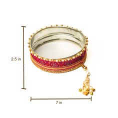 A specially curated Chalni for the auspicious celebration of Karwa Chauth.This Chalni is handmade with pure raw silk fabric and golden & pearl-colored beads that look stunning.Gift this Pooja Thali along with Chalni for your wife who would be keeping a fast for you on the festive occasion of Karwa Chauth!Let her know how much she means to you and the family.. Silk Bangles, Pooja Thali, Raw Silk Fabric, Golden Pearl, Potli Bags, Peacock Green, Indian Festivals, Gold Lace, Pearl Color