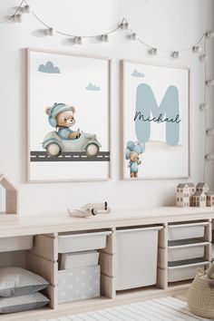 two framed pictures on the wall in a child's room with toys and decor