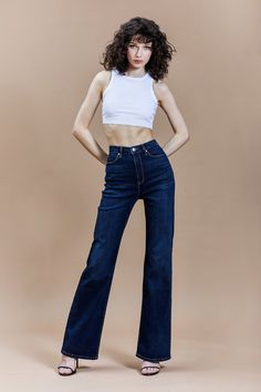 DETAILS Meet our It Girl Flare style. Hugging you in all the right places, it's perfect to pair with a boot or heel. This pair of wear-everywhere jeans has a flattering fit and '70s retro vibe. 98% Cotton/2% Spandex Machine washable Control core technology: pocket construction sculpts your midsection 5 pockets Zipper fly closure Belt loops It Girl flare Style #81437 SIZE & FIT Fitted through the hip and thigh, flared from the knee 11.25" rise (size 27) 21" leg opening (size 27) 34" inseam Model Wash Jeans Outfit, Flare Jeans Outfit, Model Jeans, Fashion Model Poses, Denim Fashion Women, High Waisted Flare Jeans, Jeans Models, Jeans With Heels, Pants Women Fashion