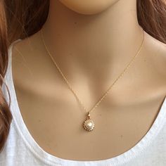 Description: 14k Solid Yellow Gold Small Pearl Cz Pendant Dainty Necklace - Minimalist Item No.: Pw05-P291/7250 Metal Type: 14k Solid Gold Metal Color: Yellow Gold Type Of Stone: Pearl And Cubic Zirconia Measurement: Pendant With Bale: 17 X 11 Mm. Pearl: 7 Mm. Chain Length: 16"-18" Adjustable Approximate Weight: Total Est. Weight: 2.02 Grams (1.9 Grams Pendant, 1.12 Grams Chain) Brand New With Box Gold Jewelry With Diamond And Pearl Pendant, Gold Diamond Jewelry With Pearl Pendant, Gold Diamond Necklace With Pearl Pendant, Gold Cubic Zirconia Diamond Necklace, Elegant Gold Plated Round Birthstone Necklace, Yellow Gold Cubic Zirconia Necklace With Pearl Pendant, Classic Gold Diamond Necklace With Pearl Pendant, Gold Cubic Zirconia Birthstone Necklace With Gemstone, Fine Jewelry Yellow Gold Diamond Necklace With Pearl Pendant