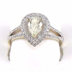 This Is A Fine Pear Cut Diamond Solitaire Ring W/Accents. It Is Made Of 100% Natural 14kt Yellow Gold And Is In Brand New Condition. It Has A Ctw Of 1.30ct And Weighs 3.3 Grams. The Fancy Diamonds Have A Clarity Of Si1 And Fancy Yellow And F Color. This Beautiful Custom Piece Has Excellent Pear Cut Diamond Stone In The Center Weighing .71ct And Brilliant Diamond Accents Along The Band Weighing .59ct. Samson Diamond Gold Pear-shaped Brilliant-cut Diamond Ring, Gold Diamond Ring With Brilliant Cut Pear Shape, Gold Pear-shaped Diamond Ring With Brilliant Cut, Gia Certified Yellow Gold Pear-shaped Ring, Gia Certified Pear-shaped Yellow Gold Ring, White Pear-shaped Diamond Ring With Diamond Cut, White Pear Shaped Diamond Ring With Diamond Cut, Gold Pear-shaped Brilliant Cut Diamond Ring, Pear-shaped Brilliant Cut Gold Diamond Ring